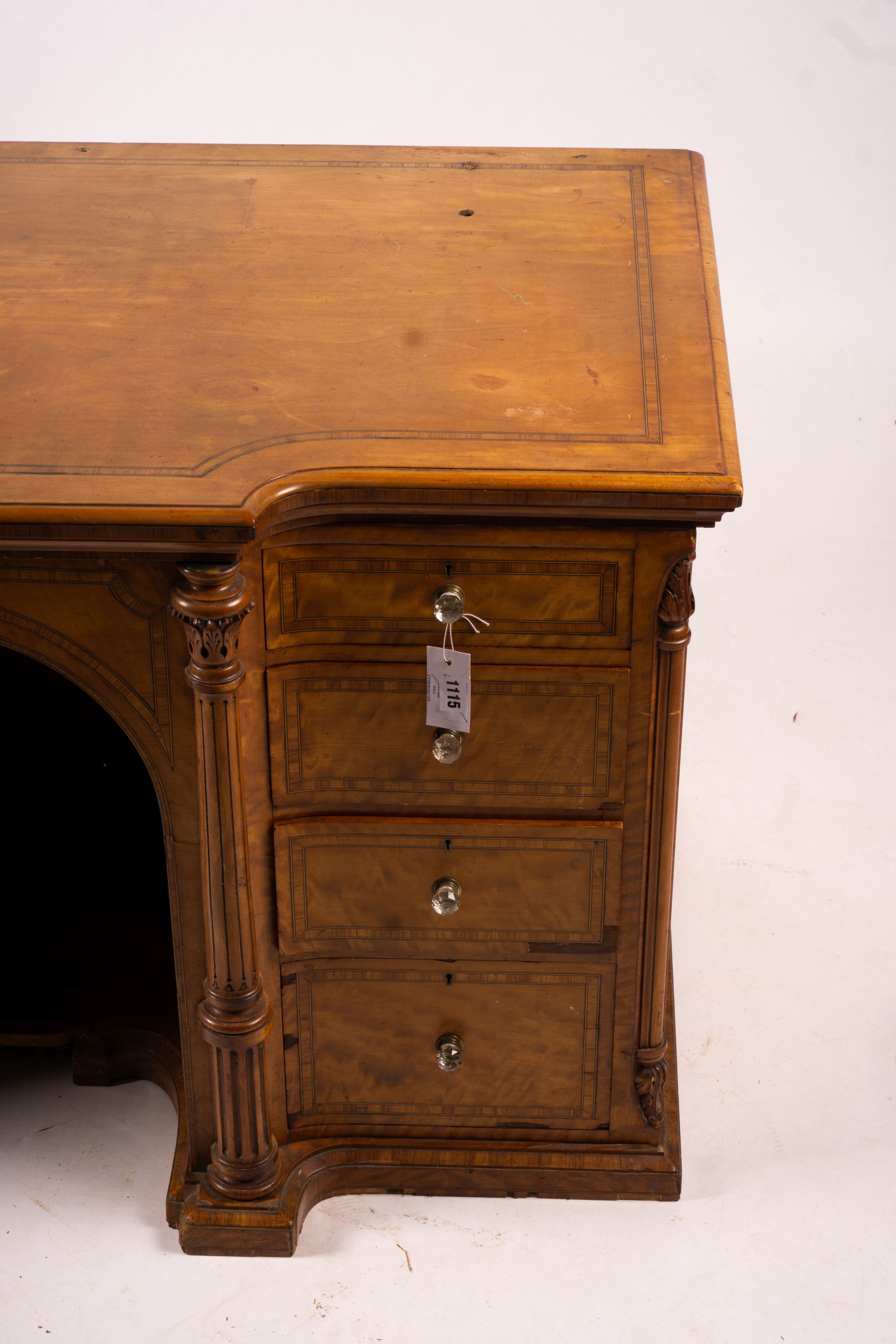 A late Victorian banded satinwood kneehole desk, width 138cm, depth 67cm, height 71cm